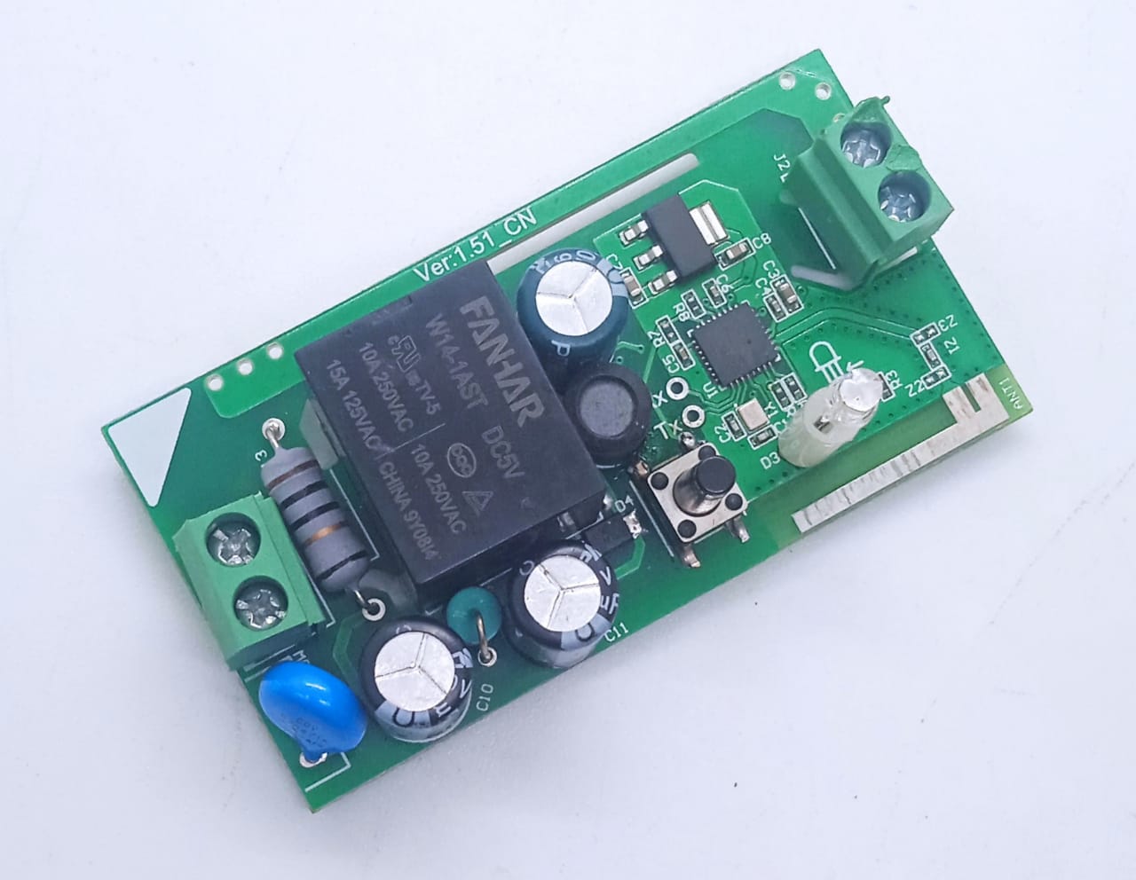 On-Off WiFi remote Switch home automation Module - a green circuit board with a black relay, two terminal blocks, a push button, and an LED.