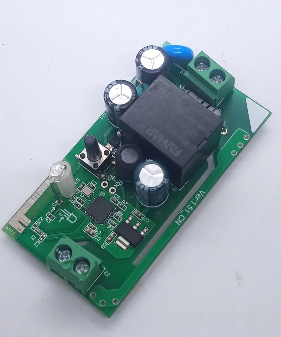 On-Off WiFi remote Switch home automation Module - a green printed circuit board with a black relay, two screw terminals, a button, and an LED indicator.