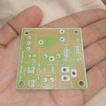 Only PCB For DIY PIR Motion Sensor Switch 5V 30A l Type Relay - a bare green printed circuit board with component labels, held in a person's hand.