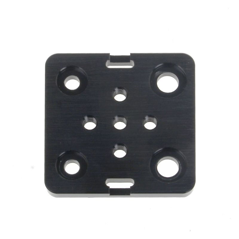 Openbuilds Special Slide Plate For Aluminum Profiles - a black rectangular metal plate featuring four large countersunk holes and five smaller threaded holes.