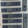 Original Inverter IC DSPIC30F2010 Microcontroller Price - a collection of black 28-pin DIP integrated circuits arranged on protective bubble wrap.
