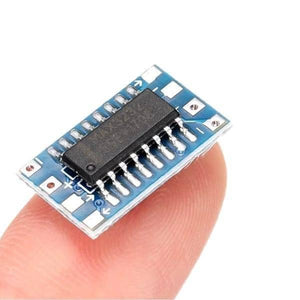 Original Mini RS232 To TTL Converter Adaptor Module Board MAX3232 Serial Port - a small blue rectangular circuit board with a black integrated chip held on a finger.
