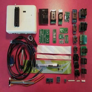Original New RT809H Emmc Nand-flash Extremely Universal Programmer RT809H 31 Adapters Suction Pen Emmc Nand - shown with its white main unit, numerous adapter boards, ribbon cables, USB and VGA cords, and a suction pen on a pink surface.