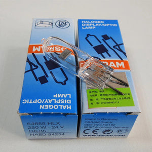 OSRAM 64655 24V 250W G6.35 Halogen Bulb For Microscope Surgical Shadowless Lamp Slide Projector Bulb - resting on two blue product boxes with printed technical specifications and manufacturer information.