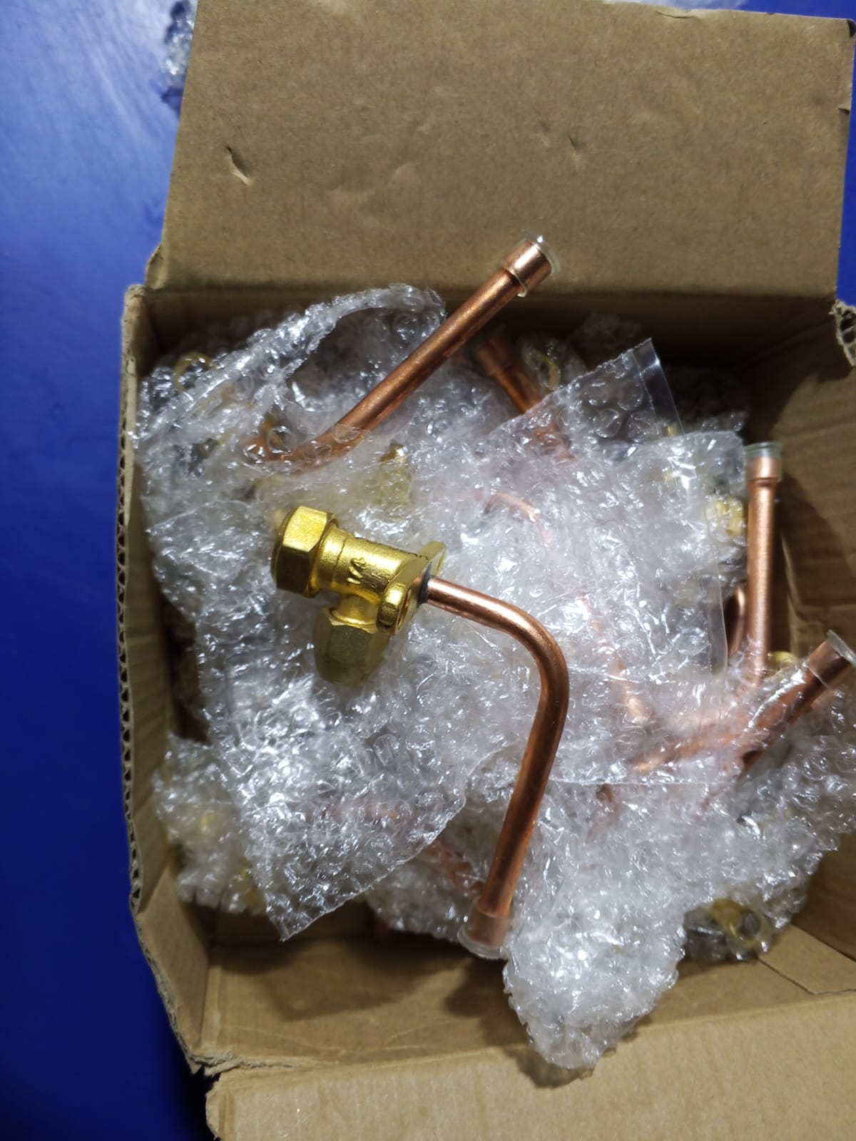 Papular Brand Brass Split AC Outdoor Service Valve SET - shown as a collection of brass valves with copper piping inside a cardboard box with bubble wrap.