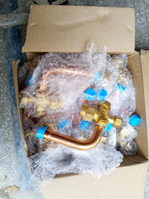 Papular Brand Brass Split AC Outdoor Service Valve SET - shown in a cardboard box, featuring multiple brass valves with copper pipes and blue plastic caps.