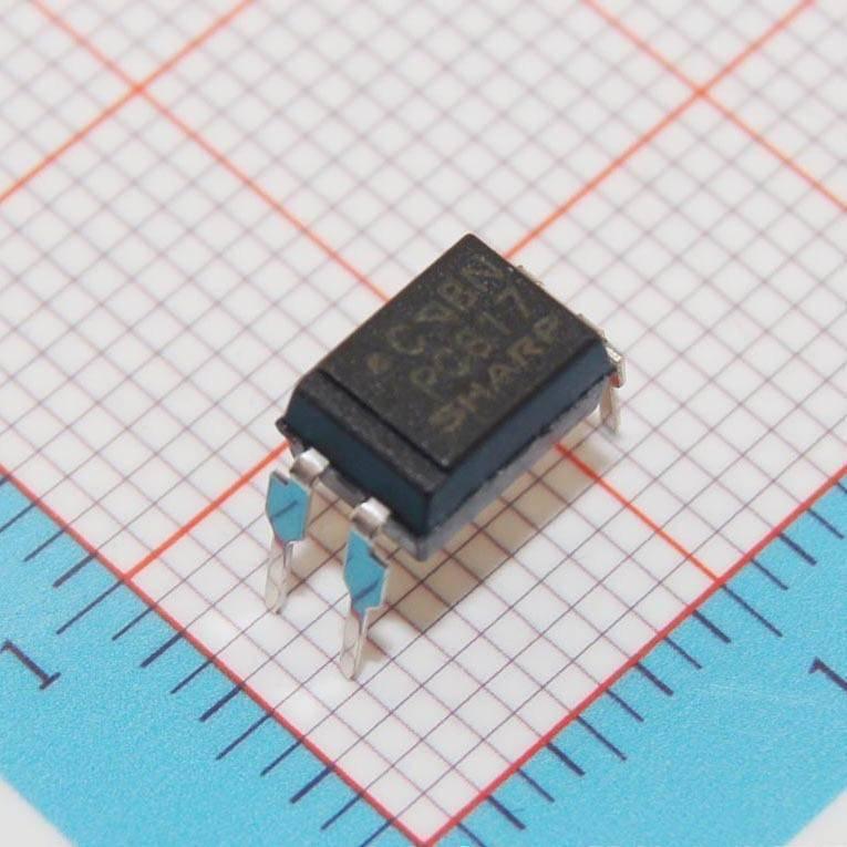 Pc817 Photocopier Opto Isolator - a black four-pin electronic component resting on a blue grid background.