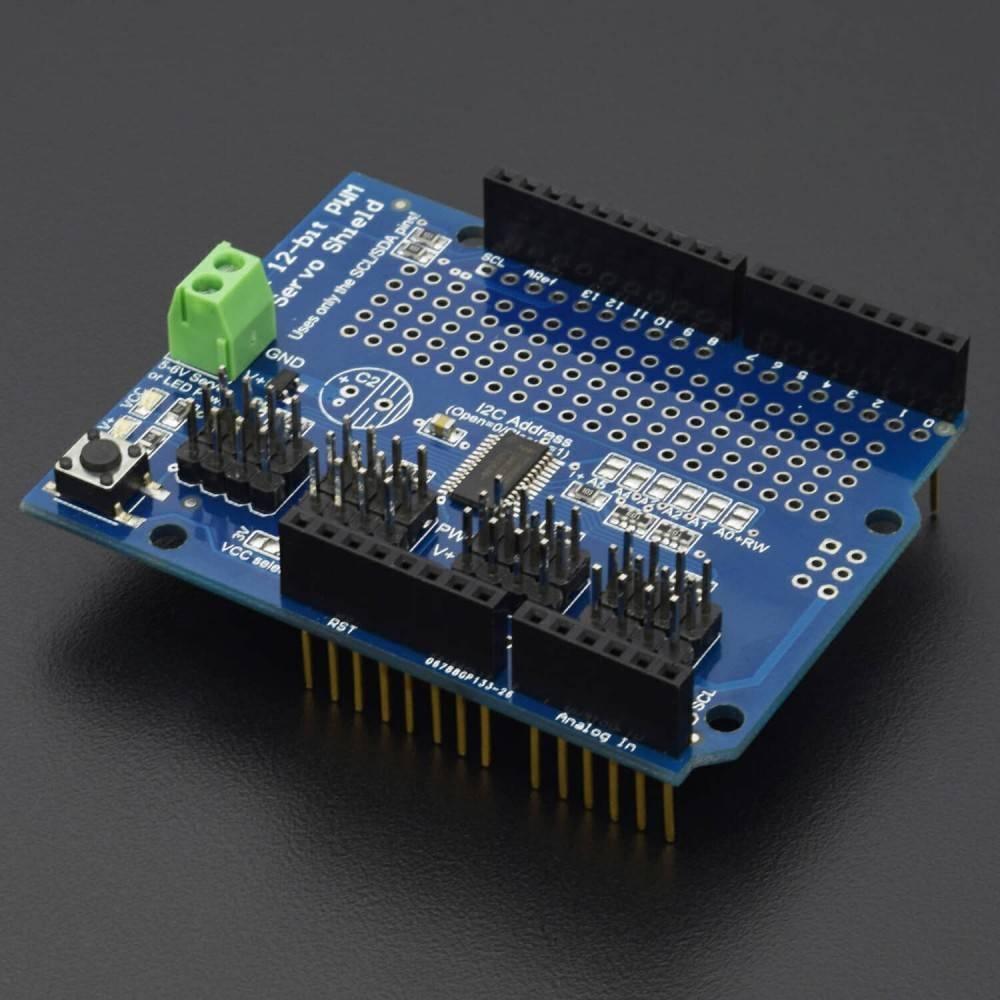PCA9685 12 Bit 16 Channel Servo Shield - a blue rectangular circuit board with a green terminal block, multiple pin headers, and a reset button.