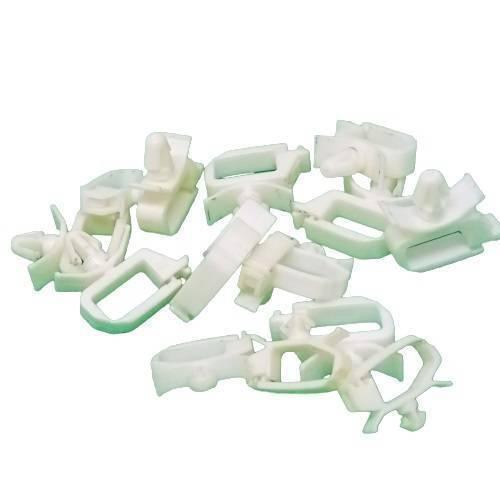 PCB Inserting Hole Cable Clamp, Body PCB Inserting Cable Clamps - a pile of white plastic cable clamps with a U-shaped body and a small protruding mounting pin.