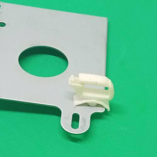 PCB Inserting Hole Cable Clamp, Body PCB Inserting Cable Clamps - a white plastic cable management clip attached to a flat, silver-colored metal mounting plate on a green background.