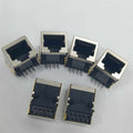 PCB Mount RJ45 Ethernet Connector - six silver and black metal-shielded modular jacks with exposed pins arranged on a white surface.