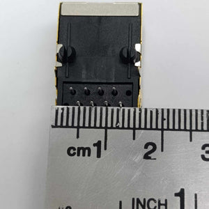 PCB Mount RJ45 Ethernet Connector - shown from the top, featuring a black plastic housing with metal shielding and pins, measured against a metal ruler.