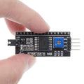 PCF8574 IIC I2c Serial Interface Adapter Module IIC I2C LCD Module - a black circuit board with a blue potentiometer, pins, and an integrated chip.