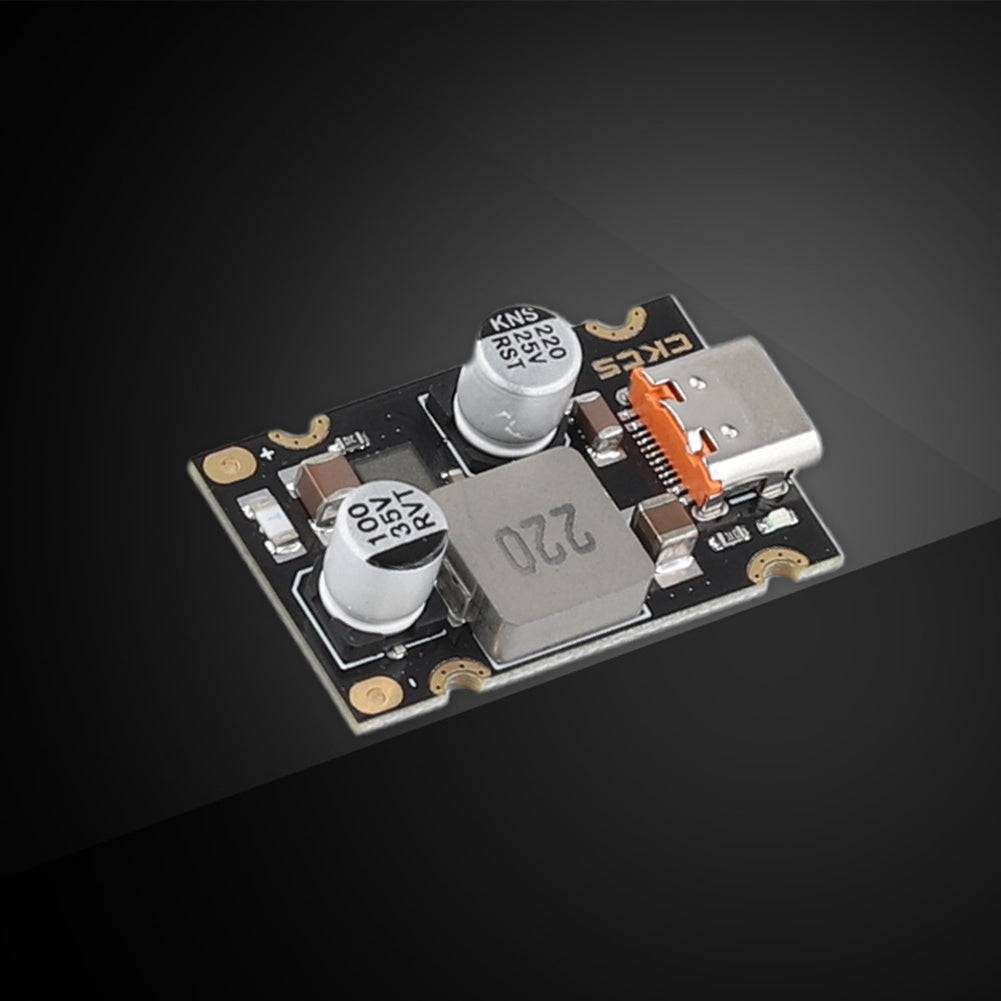 PD 65W Fast Charging Module Type C Interface Fast Charging Adapter Board DC8 to 32V Charging Protection - a black rectangular circuit board featuring a USB-C port, two cylindrical capacitors, and an inductor.