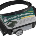Personal Magnifier Comfortable Headband Light Weight 640mm Proskit 8pk-MA003N - a black headband-mounted magnifying visor with a small circular lens and a green product information label.