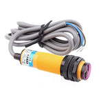 Photoelectric switch sensor E3F-DS10C4 diffuse type NPN NO DC 3 Wires transducer - a yellow cylindrical device with a black threaded housing, a lens, and an attached grey three-wire cable.