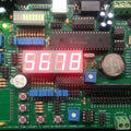 Pic Lab-iii Microchip Pic Microcontroller Development Board - a green circuit board with a red four-digit LED display showing 5678 and various ports.