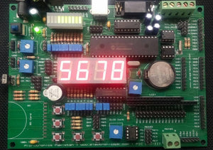 Pic Lab-iii Microchip Pic Microcontroller Development Board - a green circuit board with a red four-digit LED display showing 5678 and various ports.