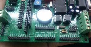 Pic Lab-iii Microchip Pic Microcontroller Development Board - a green printed circuit board with headers, a coin cell battery, and green screw terminals.
