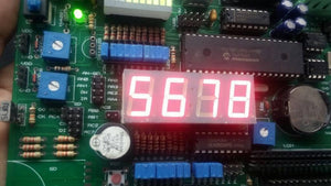 Pic Lab-iii Microchip Pic Microcontroller Development Board - a green circuit board with blue potentiometers, a red 4-digit LED display reading 5678.