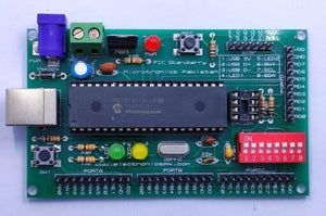 PIC Strawberry Microcontroller Development Board - a green rectangular PCB featuring a PIC18F4550 chip, USB port, power jack, DIP switches, and LEDs.