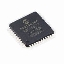 PIC18F46K22-I/PT SOP 44 On Demand Product - a black, square-shaped integrated circuit chip with metallic pins along all four sides and white text printed on its surface.
