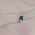 PJ431K SMD Schottky Diode – Precision Adjustable Voltage Reference - a close-up shot of the small black rectangular electronic component held in a palm, showing the text "PJ431K KC" printed on it.