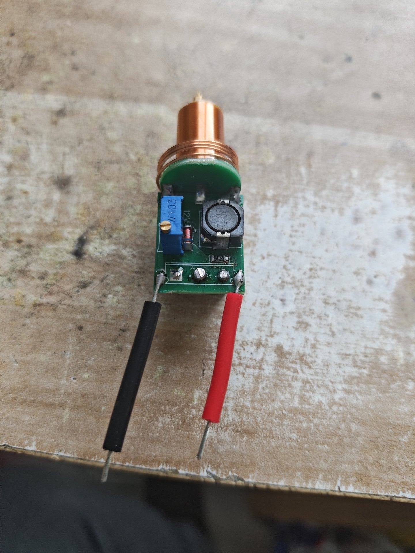 Plasma Arc Fire Head High-Frequency Electric Flame 15–24V Plasma Ignition Module-digilog.pk - the green circuit board with a copper coil, potentiometer, and wires.