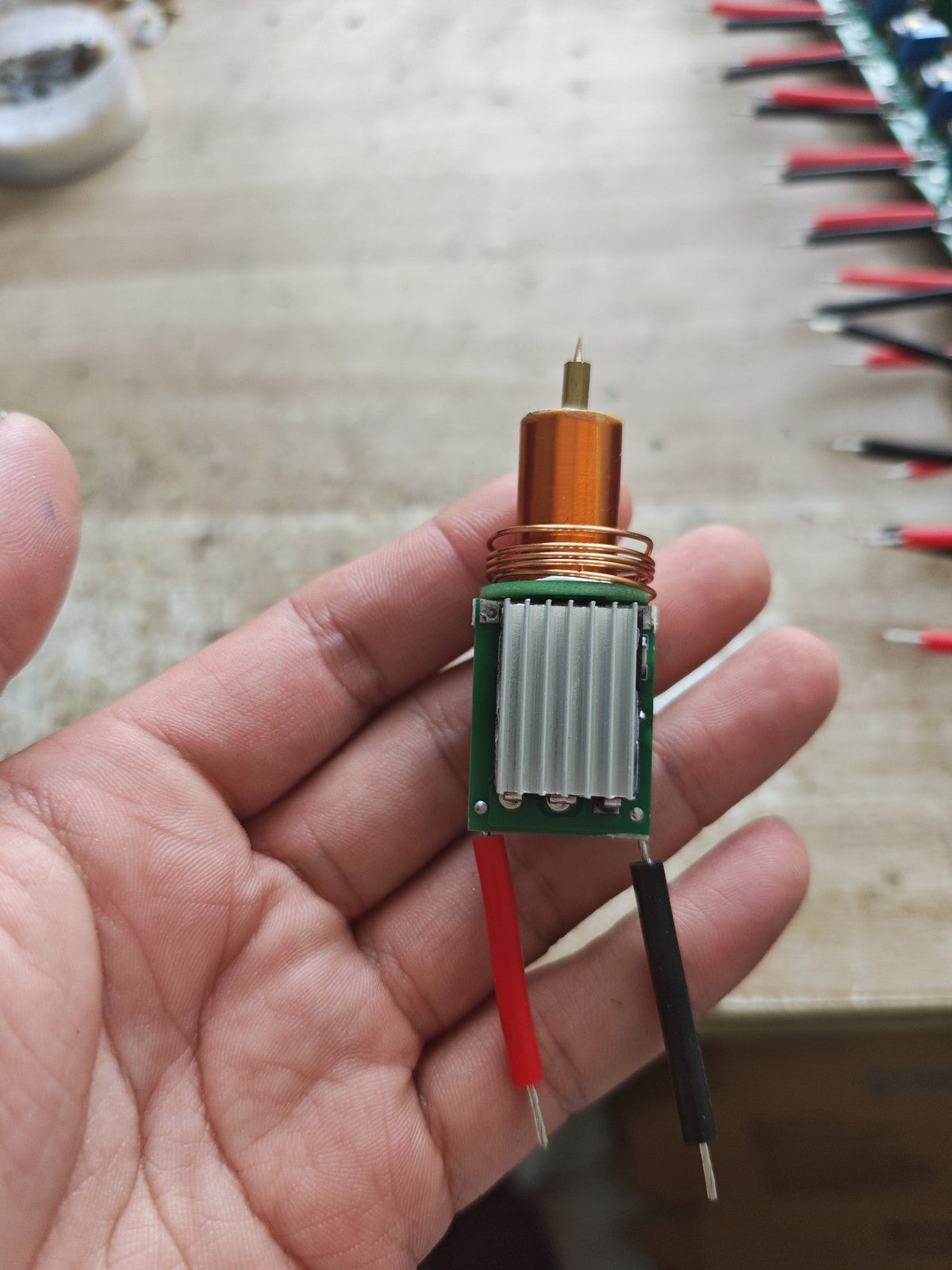 Plasma Arc Fire Head High-Frequency Electric Flame 15–24V Plasma Ignition Module-digilog.pk - a copper coil, metal heatsink, and wires.