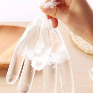 Plastic Surgical Disposable Hand Gloves - shown as a clear, thin plastic glove being held by a hand.