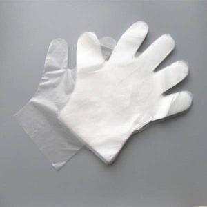 Plastic Surgical Disposable Hand Gloves - shown as a stack of thin, translucent white plastic gloves on a grey background.