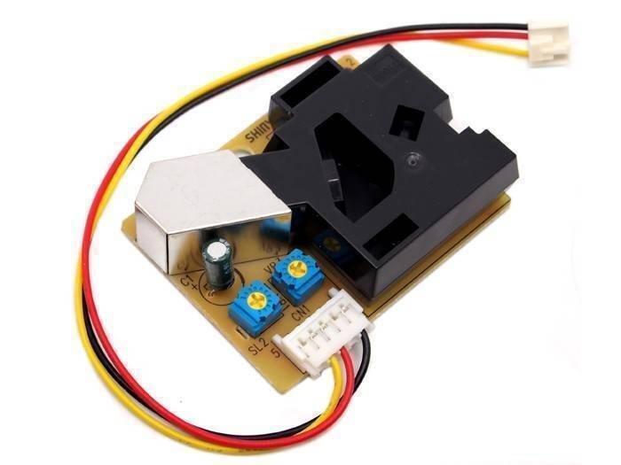 PM2.5 Dust Sensor DSM501 Dust Sensor Module - a black plastic housing, a metal shield, two blue potentiometers, and a white connector with attached wires.