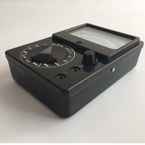 Pocket Size Analog Multimeter MF15 Digital Avometer Universal Meter - a black rectangular device featuring a rotary selection knob, a display screen, and two input ports.