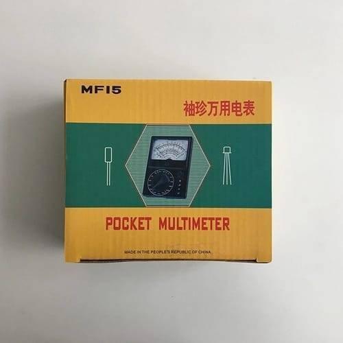 Pocket Size Analog Multimeter MF15 Digital Avometer Universal Meter - shown in its yellow and green cardboard packaging box with an illustration of the analog meter on the front.