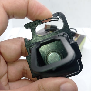Portable COB Flashlight - Emergency Light with Rechargeable Keychain - Durable Plastic Casing - a close-up of the black plastic casing and integrated carabiner clip held in a hand, with a charging cable visible in the background.
