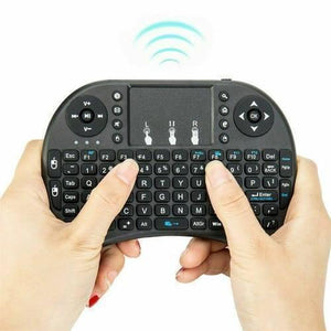 Portable Mini Wireless Keyboard Controller With Touchpad Mouse Combo And Backlight - held in two hands, showing the black QWERTY layout and touchpad.