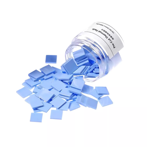 Pre-Cut Thermal Silicone Pads TE-P1 12x12x1.5mm (100 Pcs) - shown as a pile of light blue square pads spilling out of a clear plastic jar with a label.
