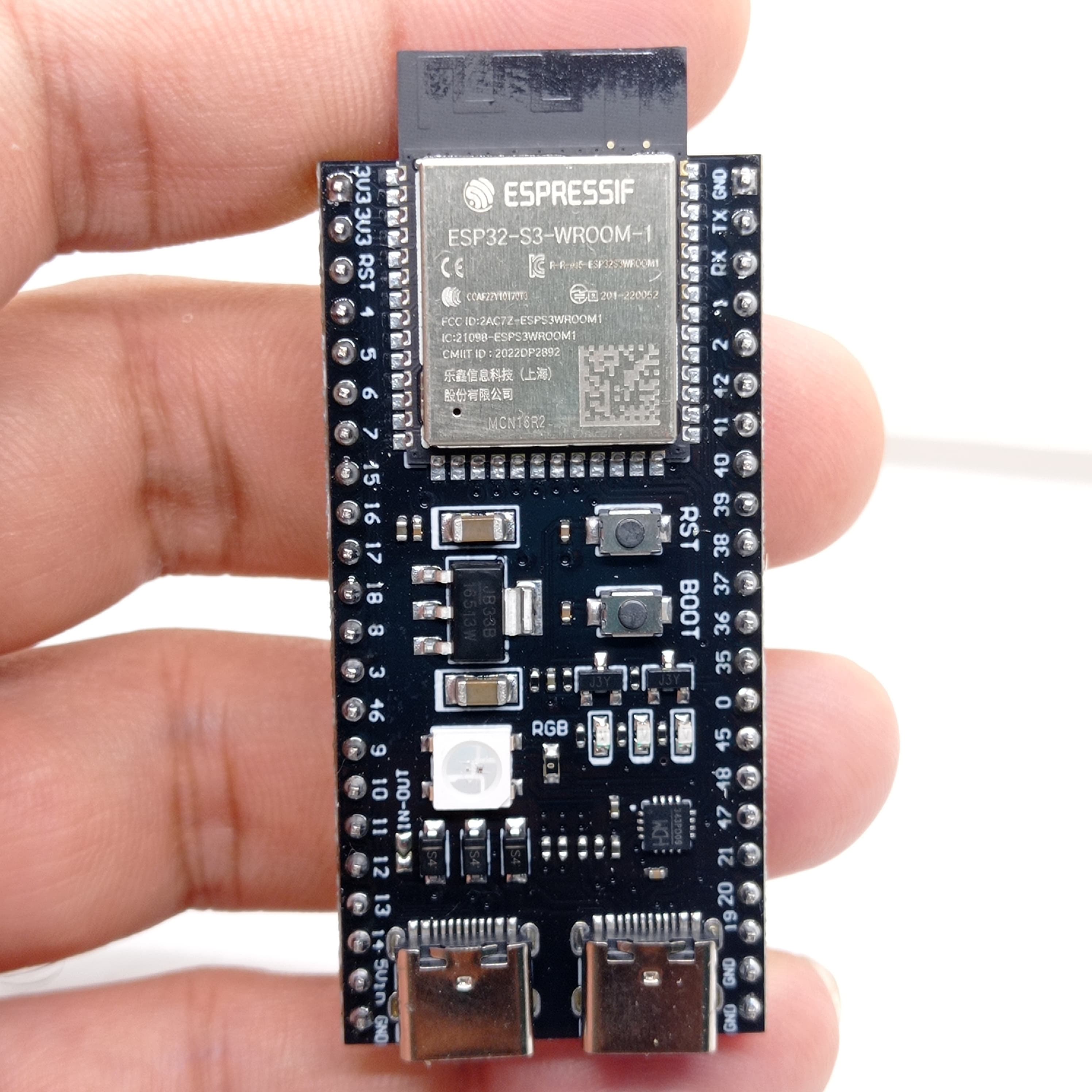 Pre Soldered ESP32-S3-DevKitC-1-N8R2 WROOM 1 Development Board 2.4G WiFi BT Module BLE5.0 - a black rectangular PCB held in a hand featuring an ESP32-S3 module, two buttons, and two USB ports.