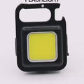 COB Rechargeable Keychain Flashlight | Mini Small Flashlight With 3 Light Modes, Folding Bracket, Bottle Opener, And Magnet Base For Fishing, Walking, - product video, preview showing a black square keychain light with a large yellow COB panel and bottle opener