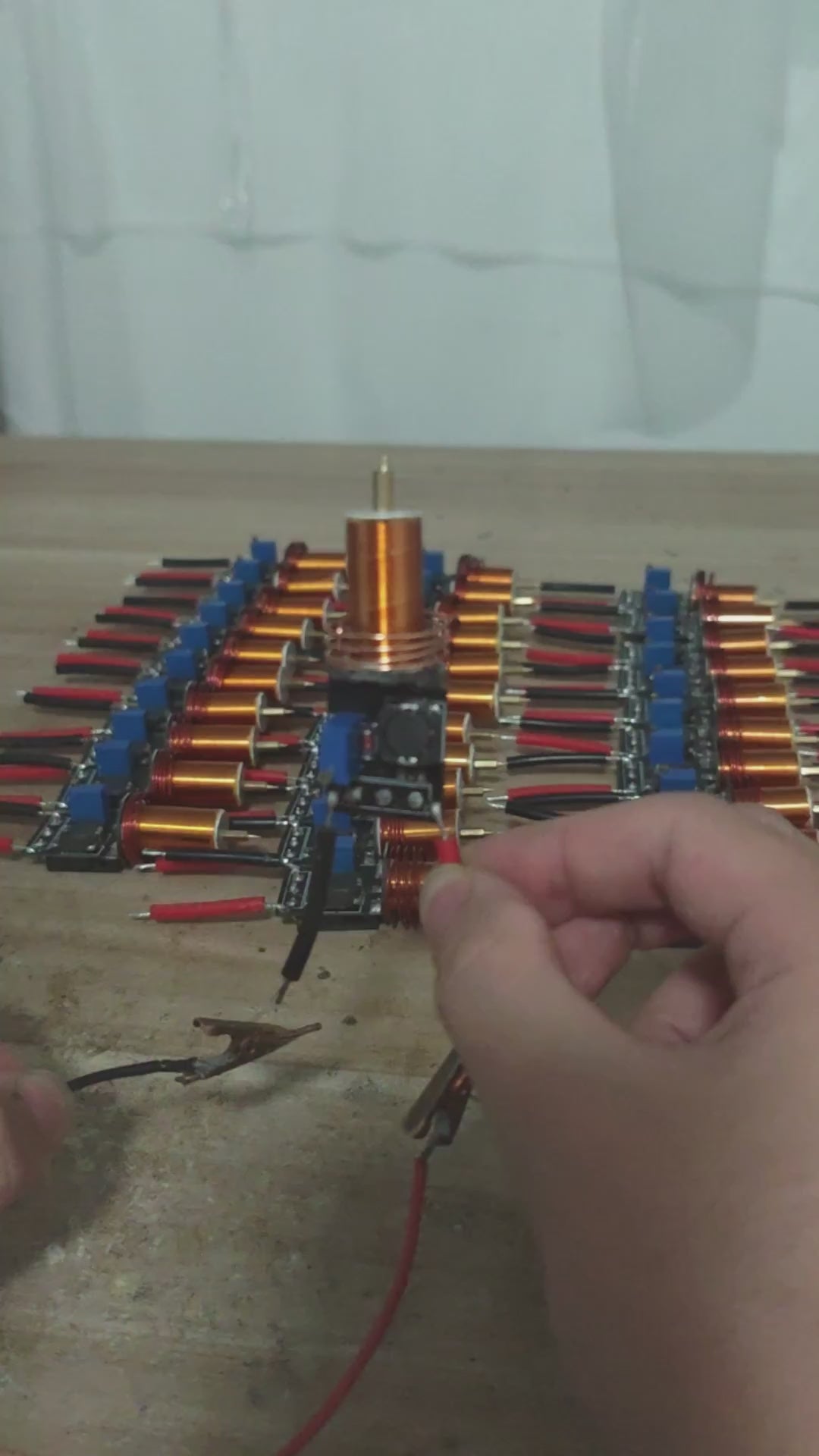 Plasma Arc Fire Head High-Frequency Electric Flame 15–24V Plasma Ignition Module-digilog.pk - product video, preview showing an array of copper-wound coils and electronic components being handled