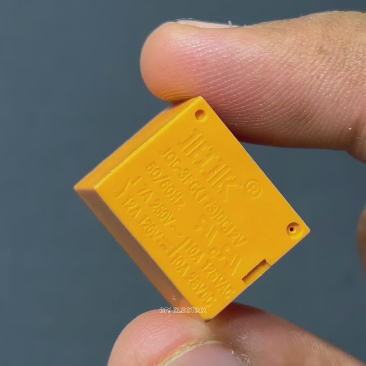 Reed Switch Sensor Reed Sensor Magneto Magnet Magnetic Switch Normally Close - product video, preview showing a small yellow rectangular electronic relay component held by fingers