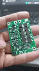 3s 40A BMS 11.1V 12.6V 18650 Lithium Battery Protection Board With 100mA Balancing Feature - product video, preview showing green circuit board with multiple black components held in a hand