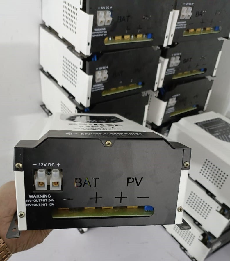 Prince 60A MPPT Solar Charge Controller With Wapda Option - close-up of the black and white front panel featuring BAT and PV terminals, DC ports, and warning text.