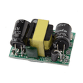 Professional PCB Mount 5V 700mA 3.5W AC-DC Step Down Isolated Switching Power Supply Module - a small green circuit board with capacitors and transformer.