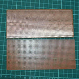 Project Board | Veroboard | Prototyping Board | Stripboard - two brown rectangular circuit boards with rows of holes on a green cutting mat.