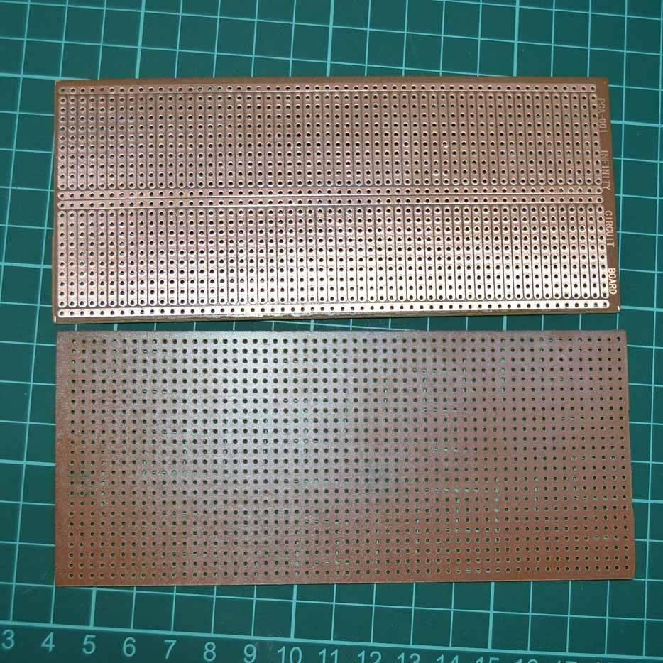 Project Board | Veroboard | Prototyping Board | Stripboard - two brown rectangular circuit boards with rows of holes on a green cutting mat.