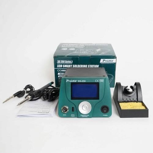Proskit 90W LCD Smart Soldering Station SS-259 - shown with its green box, soldering iron, stand with sponge, and manual on a white background.