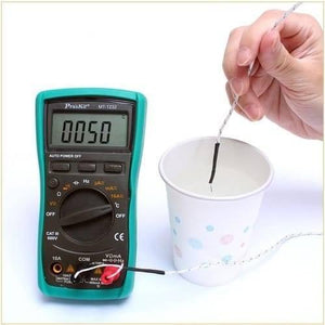 Proskit Autorange Digital Multimeter Mt 1232 For AC DC Voltage Current Resistance Temperature Measurement Tester - with a green body, rotary dial, and LCD screen showing 0050, connected to a temperature probe submerged in a cup.