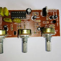 PT2399 Audio Mic Module - a brown circuit board with an integrated circuit, three silver potentiometers, capacitors, resistors, and a 7805 regulator.