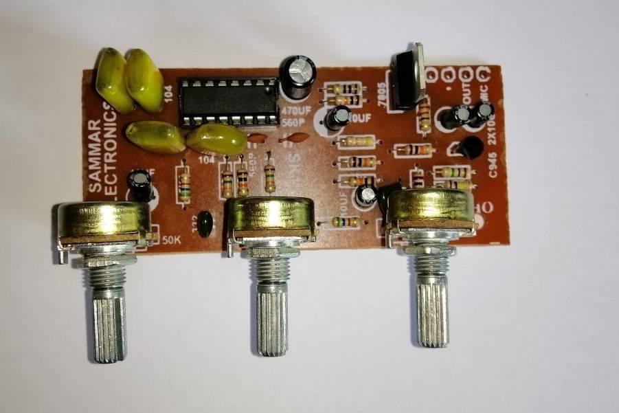 PT2399 Audio Mic Module - a brown circuit board with an integrated circuit, three silver potentiometers, capacitors, resistors, and a 7805 regulator.